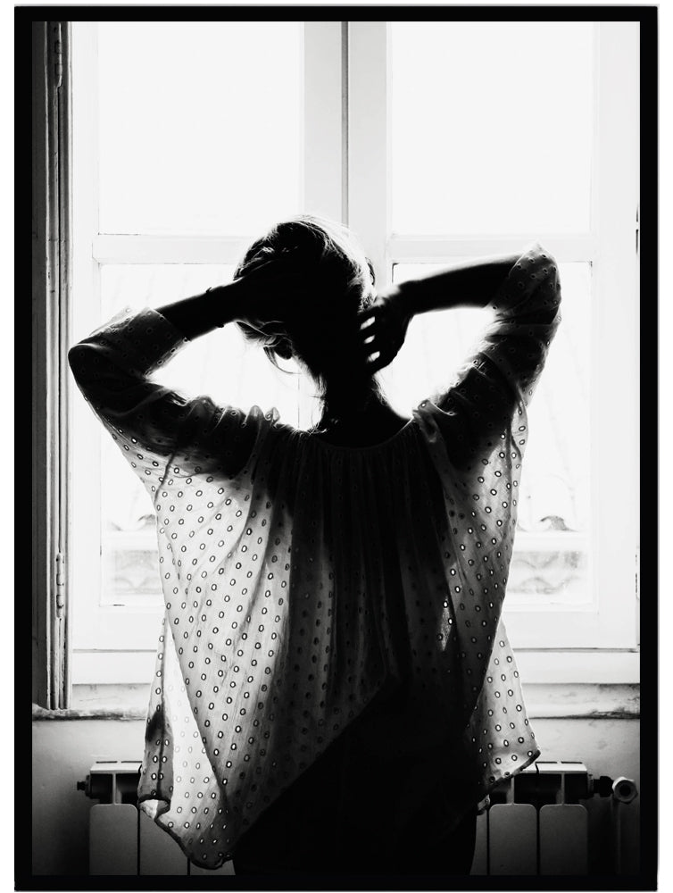 Poster Woman in front of a window